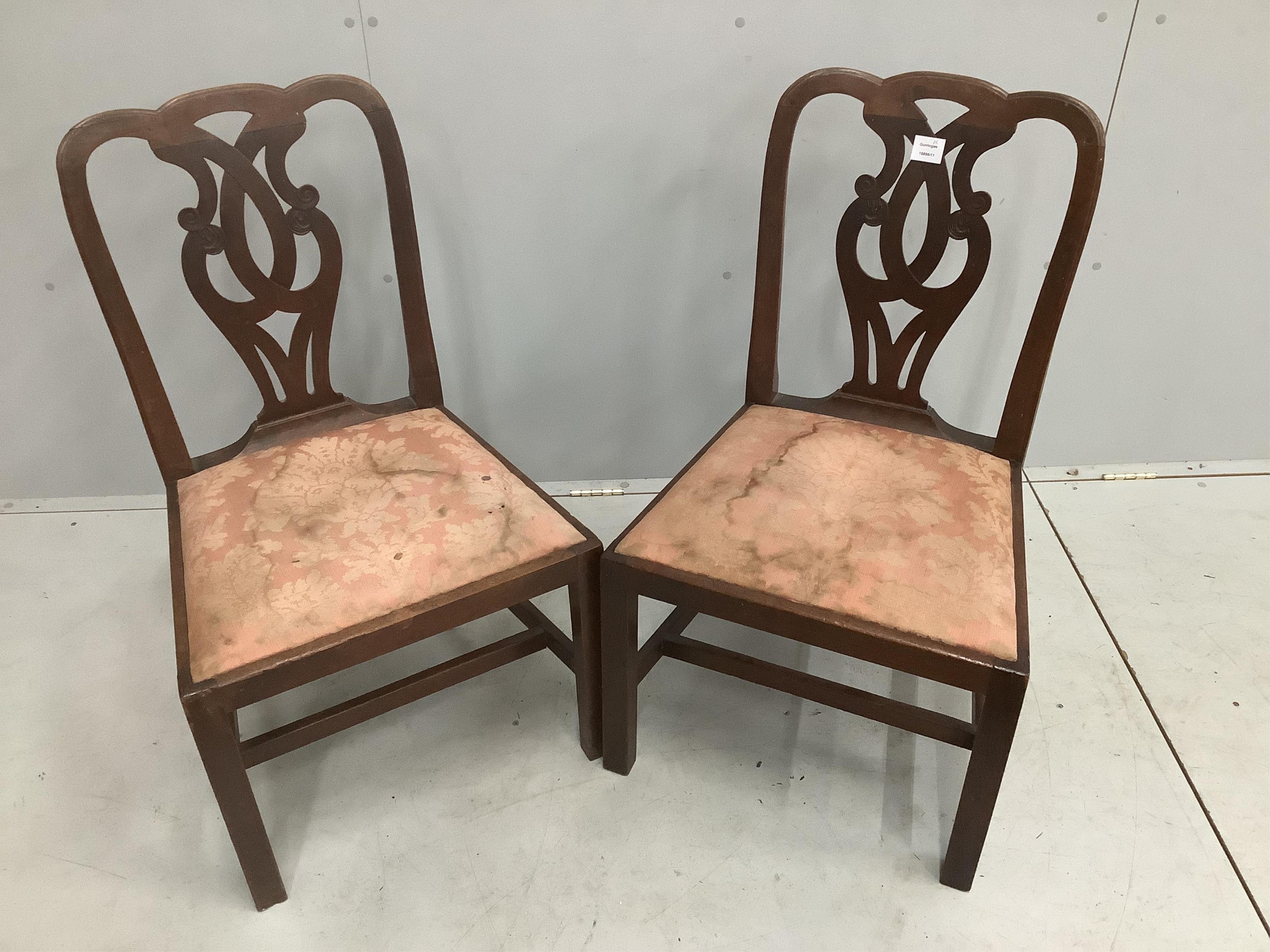 A pair of George III mahogany dining chairs with pierced splat backs, width 54cm, depth 46cm, height 92cm. Condition - fair